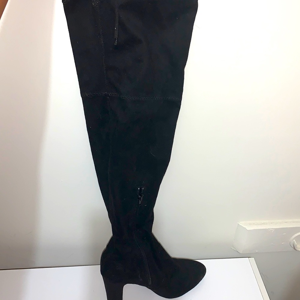 Black thigh boots.